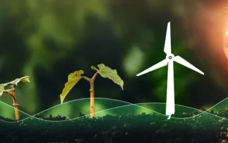 young plant growing from soil next to a miniature wind turbine